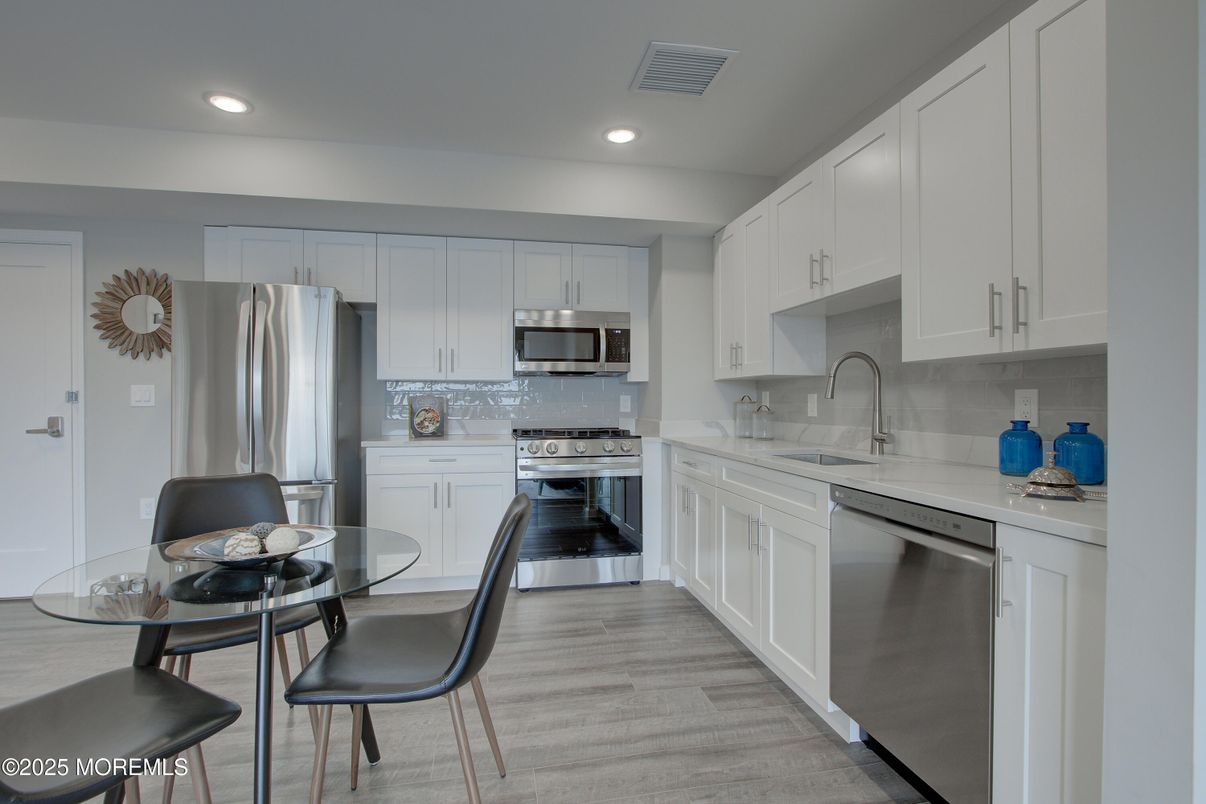 Dining room, Interior, Kitchen, Recessed Lighting, Stainless Steel Appliances, Wood Texture Flooring