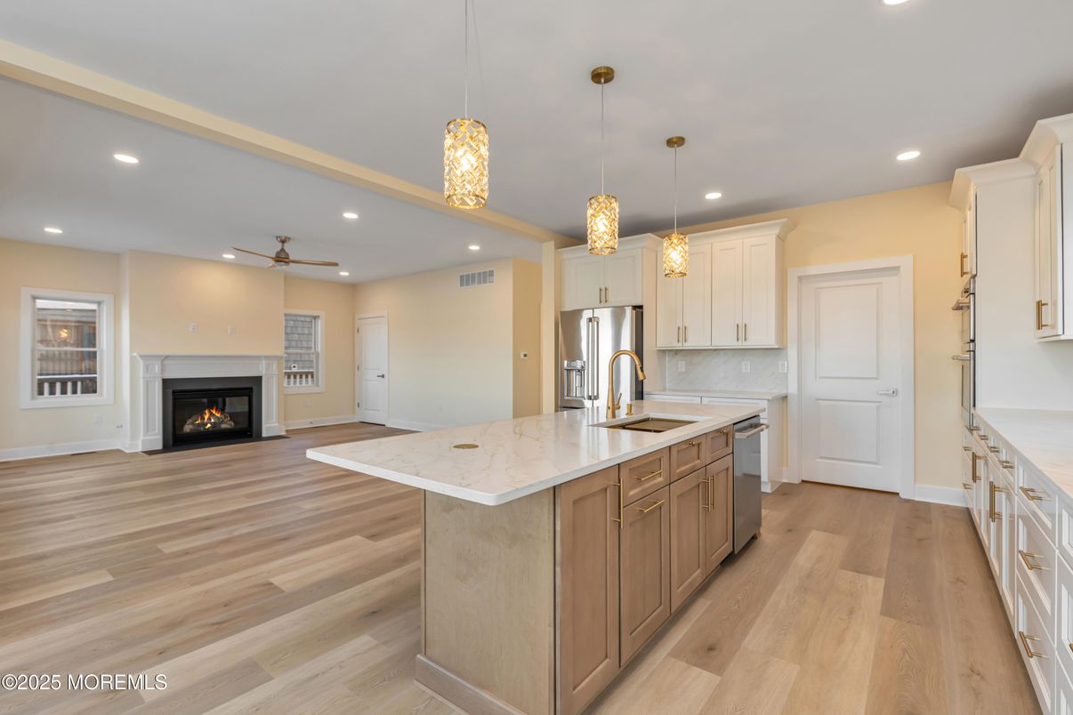 Fireplace, Interior, Kitchen, Pendant Lights, Recessed Lighting, Stainless Steel Appliances, Wood Texture Flooring