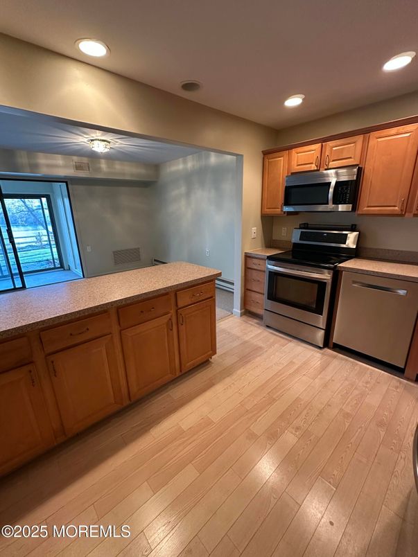 Interior, Kitchen, Recessed Lighting, Stainless Steel Appliances, Wood Texture Flooring