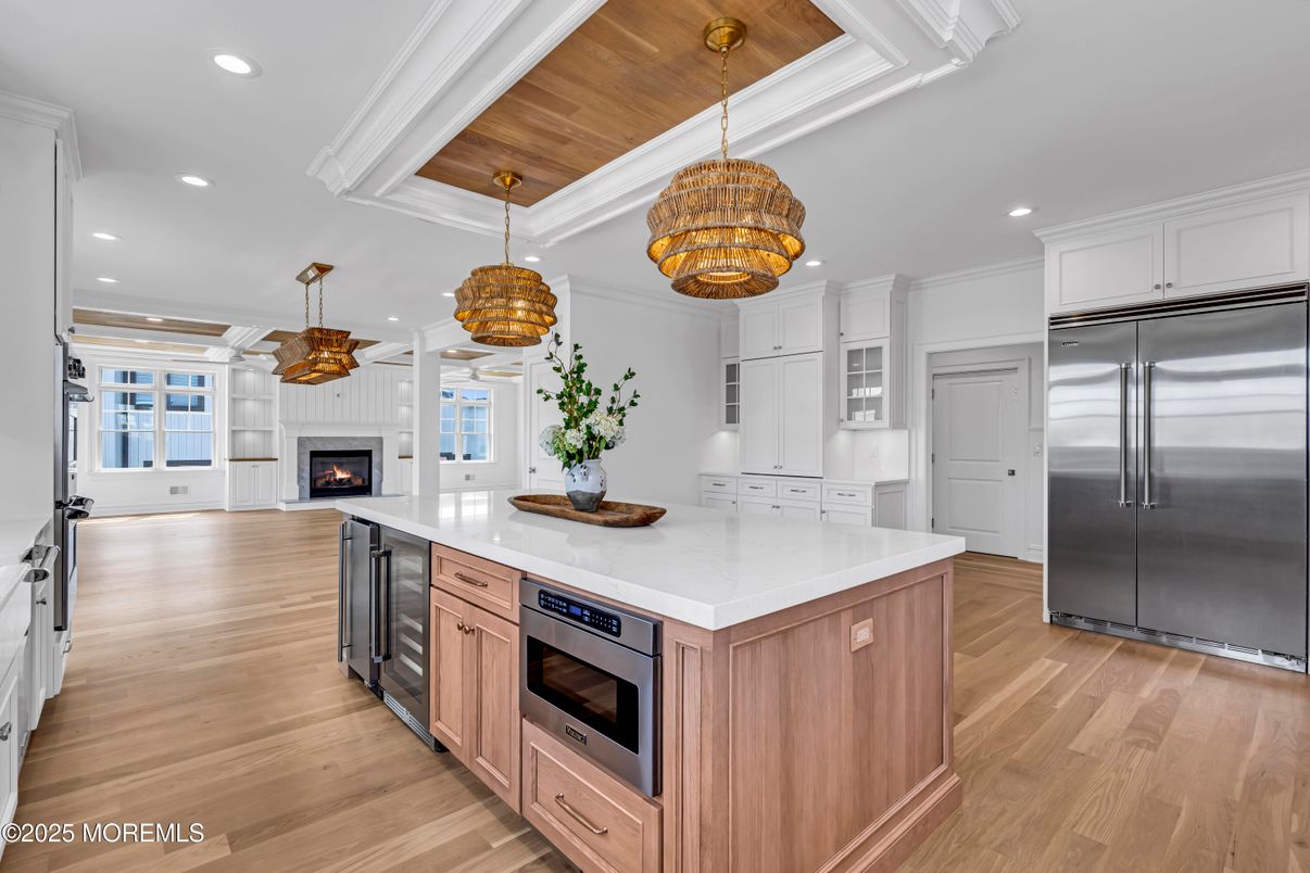 Fireplace, Interior, Kitchen, Pendant Lights, Recessed Lighting, Stainless Steel Appliances, Wooden Ceilings, Wood Texture Flooring