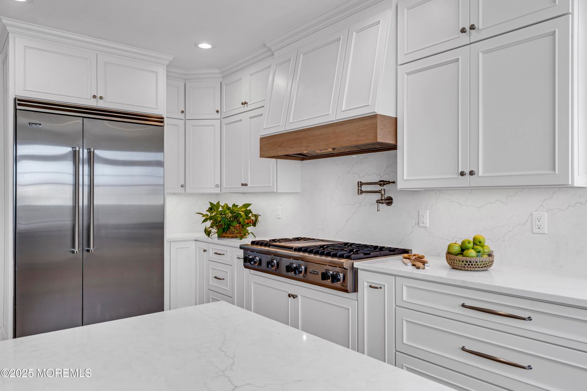 Interior, Kitchen, Marble Walls, Recessed Lighting, Stainless Steel Appliances