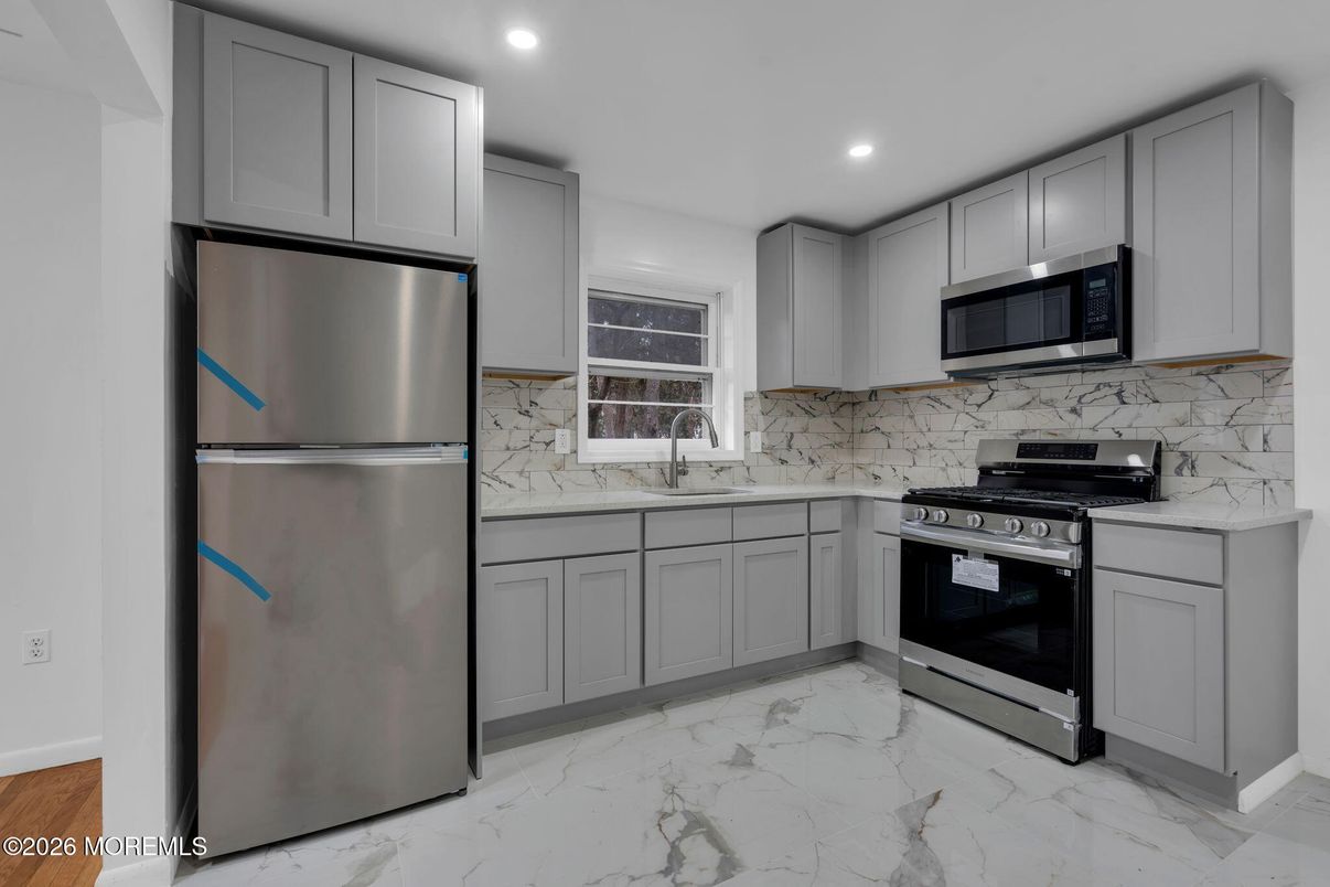 Interior, Kitchen, Marble, Marble Walls, Recessed Lighting, Stainless Steel Appliances