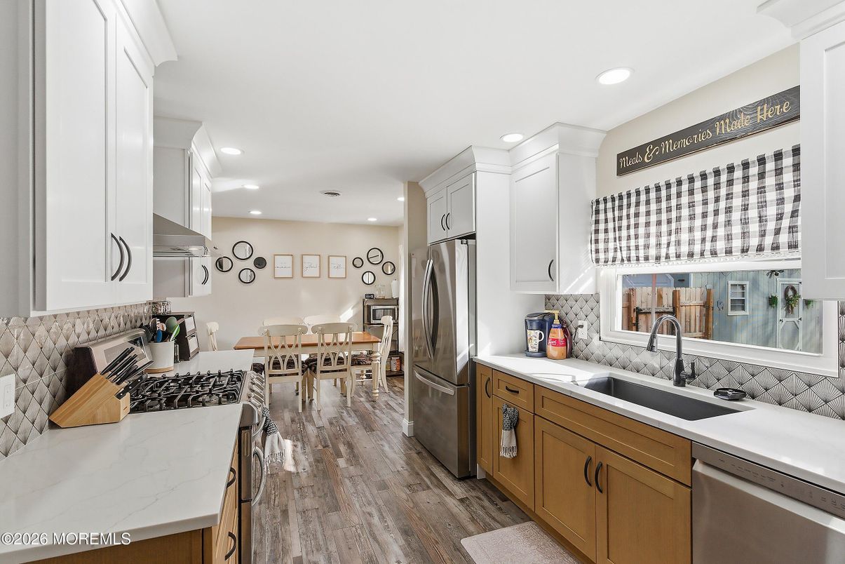 Dining room, Interior, Kitchen, Recessed Lighting, Stainless Steel Appliances, Wood Texture Flooring
