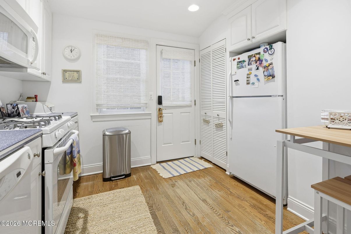 Interior, Kitchen, Recessed Lighting, Washer, Wood Texture Flooring