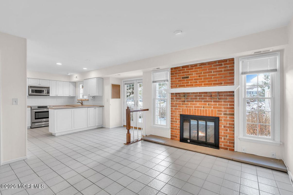 Fireplace, Interior, Kitchen, Recessed Lighting, Stainless Steel Appliances, Stone Walls