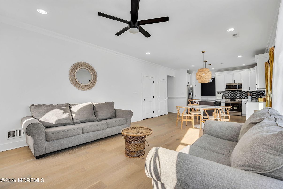 Chandelier, Dining room, Interior, Kitchen, Living room, Pendant Lights, Recessed Lighting, Stainless Steel Appliances, Wood Texture Flooring