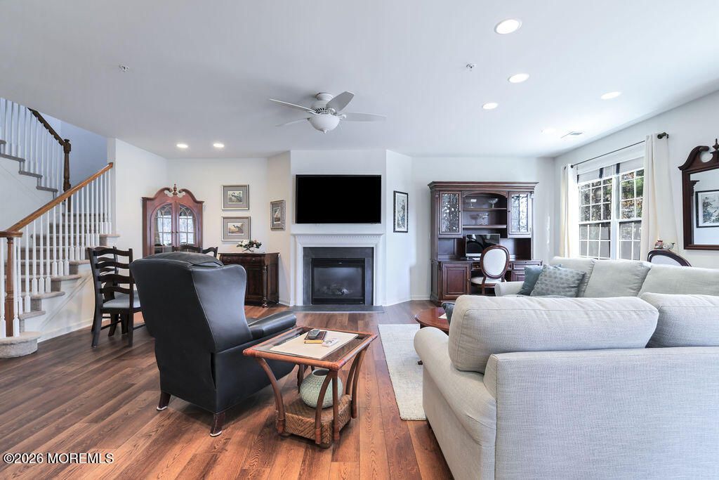 Dining room, Fireplace, Interior, Living room, Recessed Lighting, Wood Texture Flooring