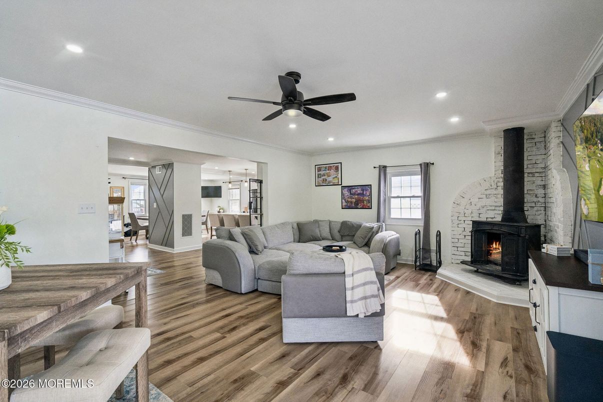 Fireplace, Interior, Living room, Recessed Lighting, Stone Walls, Wood Texture Flooring