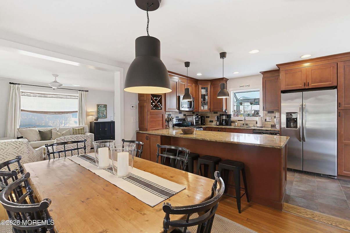 Dining room, Interior, Kitchen, Living room, Pendant Lights, Recessed Lighting, Stainless Steel Appliances, Wood Texture Flooring