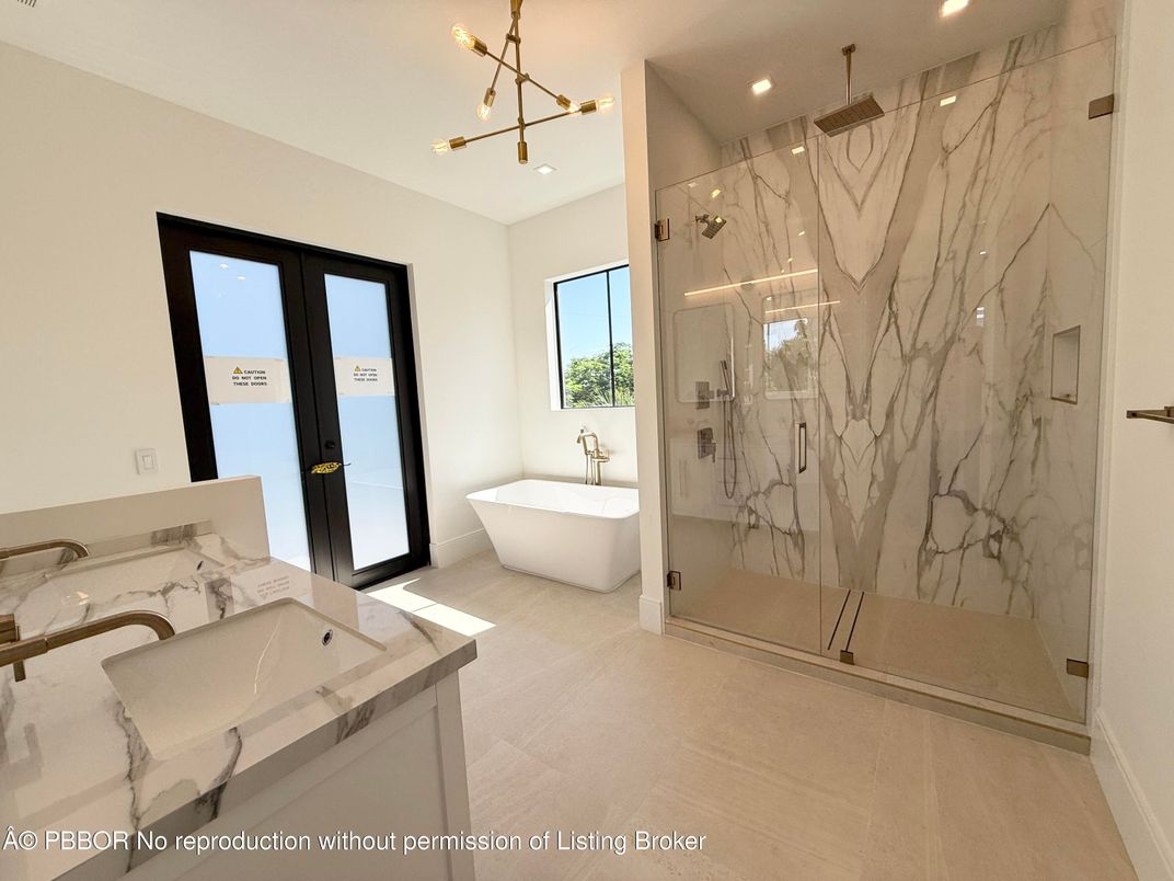 Bathroom, Dual Sink Vanities, Free Standing Baths, Glass Shower, Interior, Marble Walls, Recessed Lighting