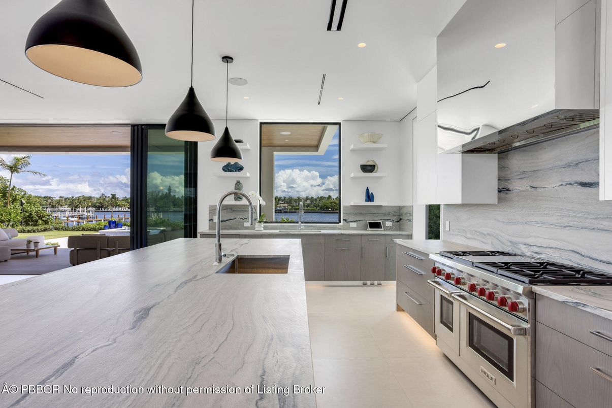 Interior, Kitchen, Marble Walls, Pendant Lights, Recessed Lighting, Stainless Steel Appliances