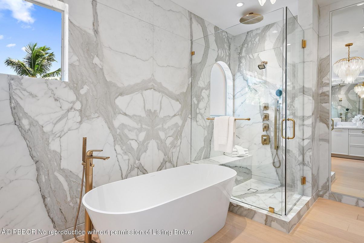 Bathroom, Free Standing Baths, Glass Shower, Interior, Marble Walls, Pendant Lights, Recessed Lighting, Wood Texture Flooring