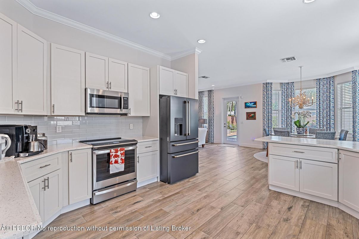 Chandelier, Interior, Kitchen, Pendant Lights, Recessed Lighting, Stainless Steel Appliances, Wood Texture Flooring