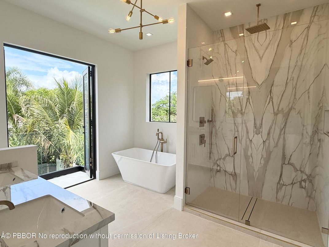 Bathroom, Free Standing Baths, Glass Shower, Interior, Marble Walls, Pendant Lights, Recessed Lighting