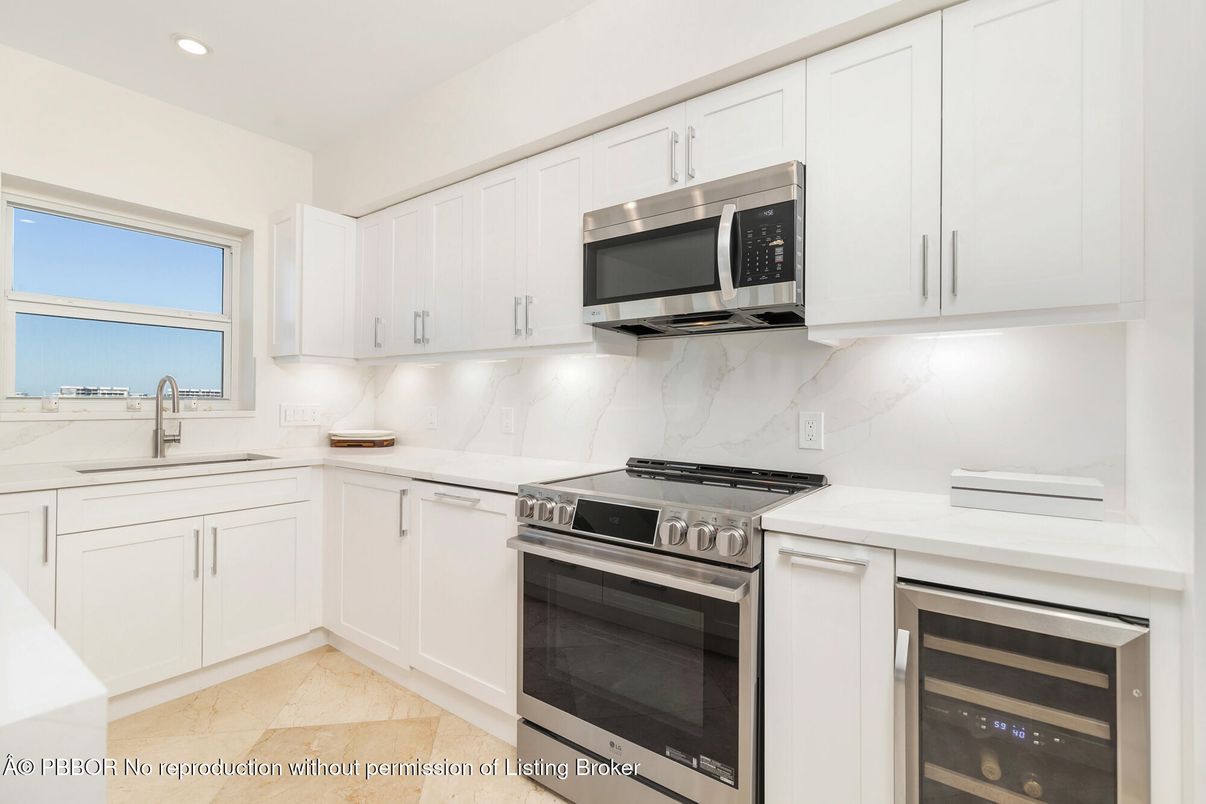 Interior, Kitchen, Marble Walls, Recessed Lighting, Stainless Steel Appliances