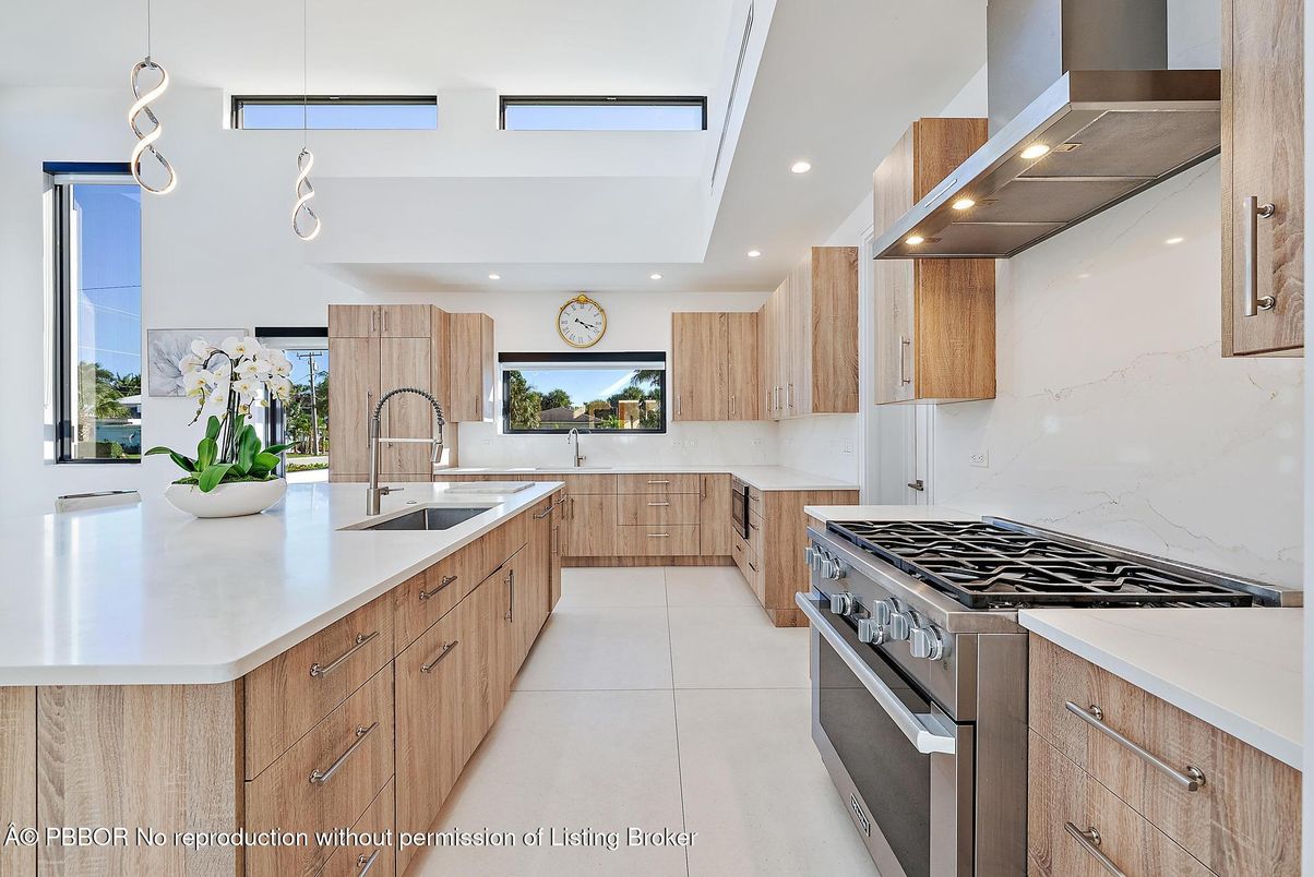 Interior, Kitchen, Marble Walls, Pendant Lights, Recessed Lighting, Stainless Steel Appliances