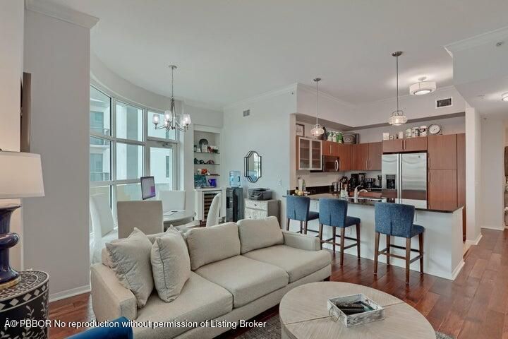 Chandelier, Dining room, Interior, Kitchen, Living room, Pendant Lights, Stainless Steel Appliances, Wood Texture Flooring