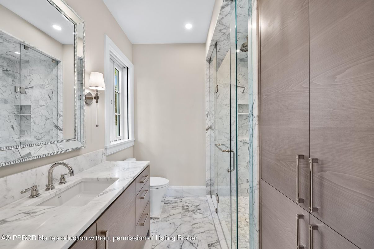 Bathroom, Dual Sink Vanities, Glass Shower, Interior, Marble, Marble Walls, Recessed Lighting