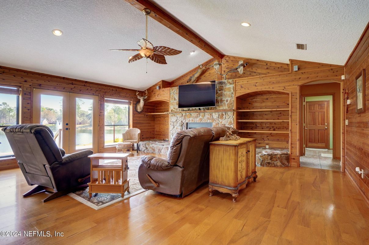 Fireplace, Interior, Living room, Recessed Lighting, Stone Walls, Wood Texture Flooring, Wooden Walls