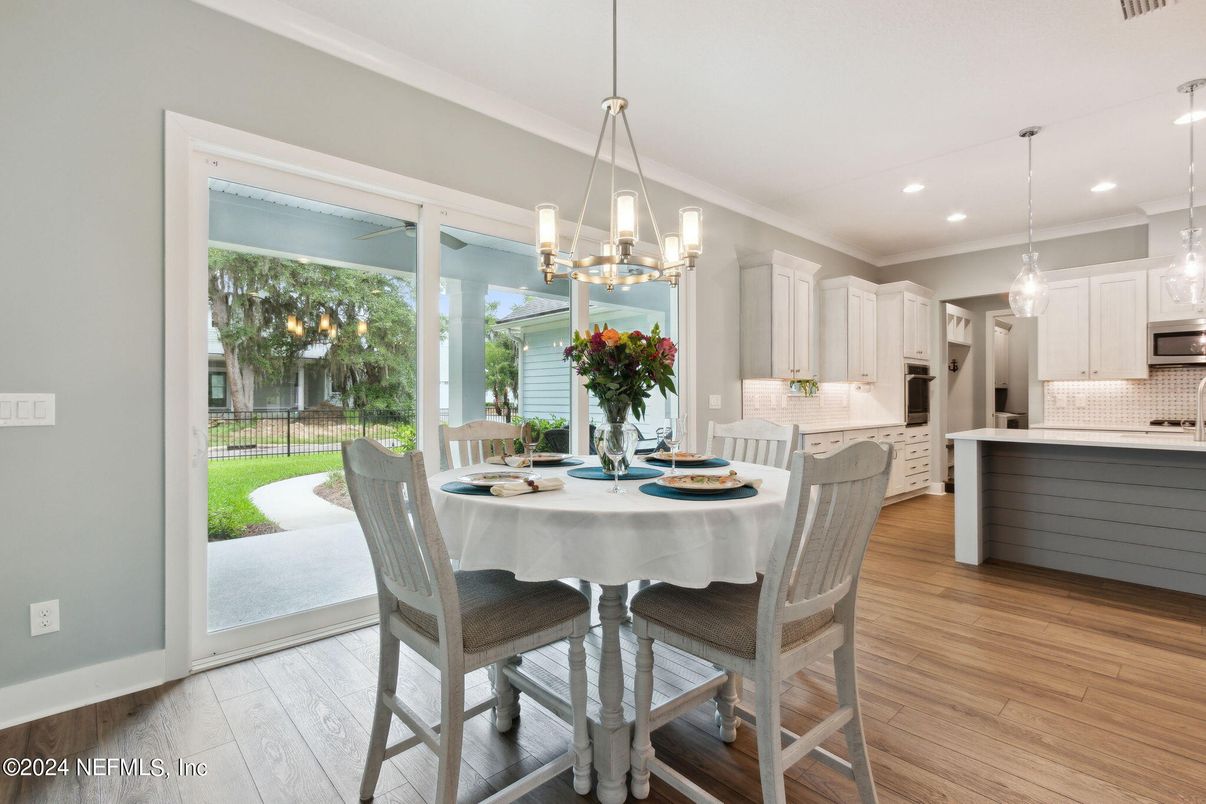 Chandelier, Dining room, Interior, Kitchen, Pendant Lights, Recessed Lighting, Stainless Steel Appliances, Wood Texture Flooring