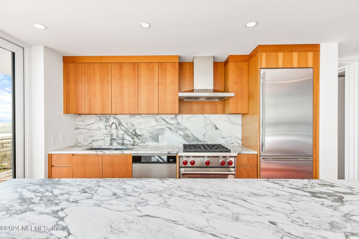 Interior, Kitchen, Marble Walls, Recessed Lighting, Stainless Steel Appliances