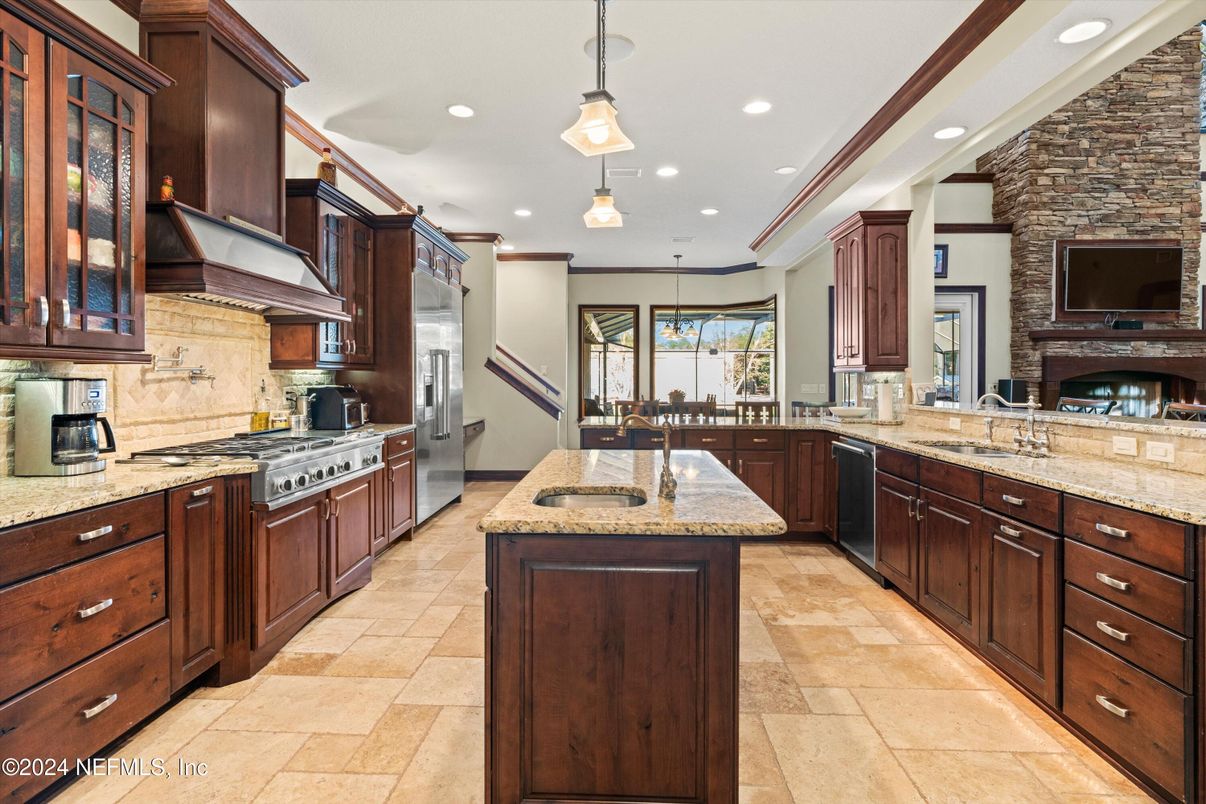 Fireplace, Interior, Kitchen, Pendant Lights, Recessed Lighting, Stainless Steel Appliances, Stone Walls