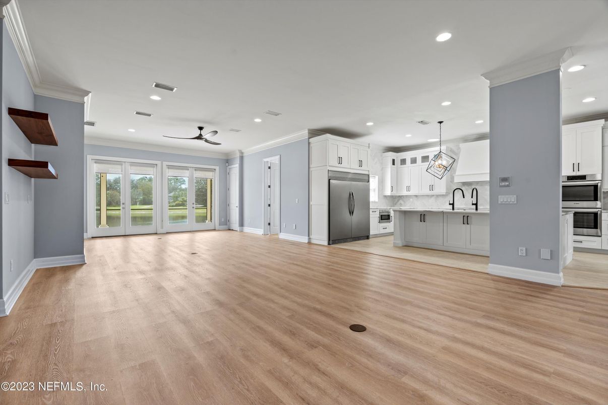 Empty room, Interior, Kitchen, Pendant Lights, Recessed Lighting, Stainless Steel Appliances, Wood Texture Flooring