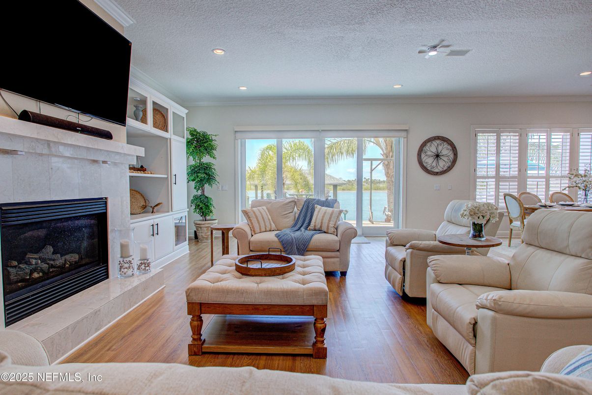 Fireplace, Interior, Living room, Recessed Lighting, Water, Wood Texture Flooring