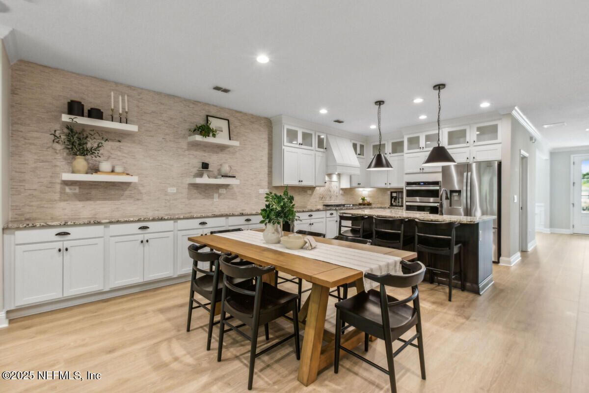 Dining room, Interior, Kitchen, Pendant Lights, Recessed Lighting, Stainless Steel Appliances, Stone Walls, Wood Texture Flooring