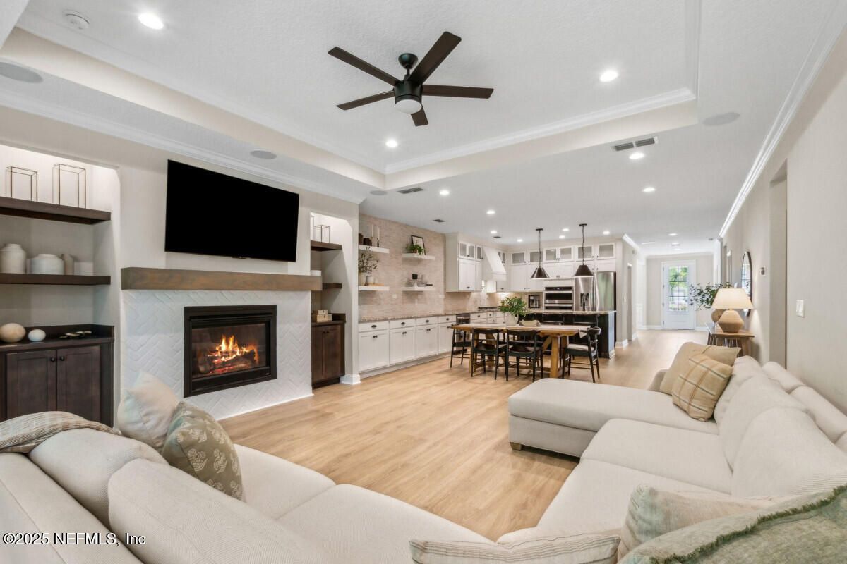 Dining room, Fireplace, Interior, Kitchen, Living room, Pendant Lights, Recessed Lighting, Stainless Steel Appliances, Wood Texture Flooring