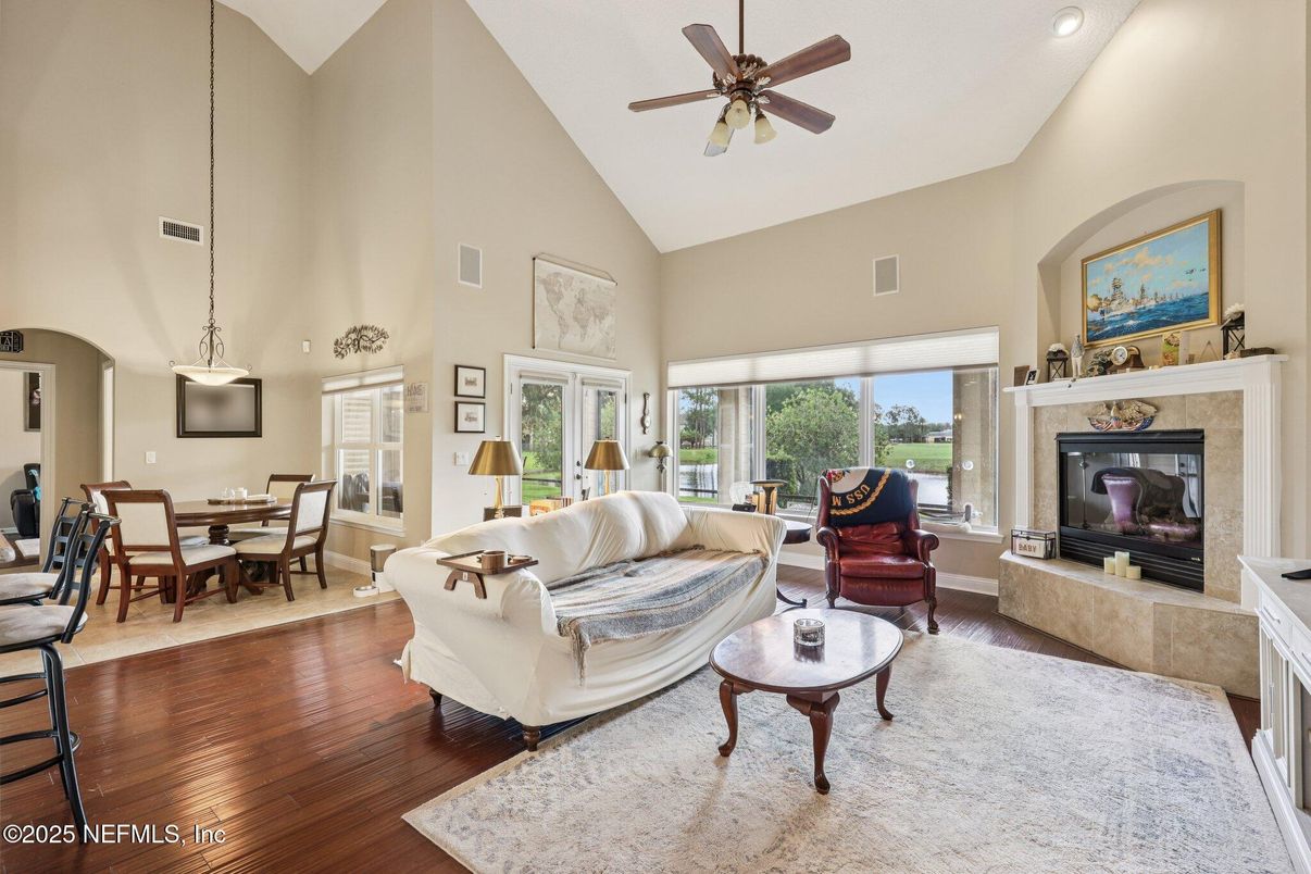 Dining room, Fireplace, Interior, Living room, Pendant Lights, Recessed Lighting, Wood Texture Flooring