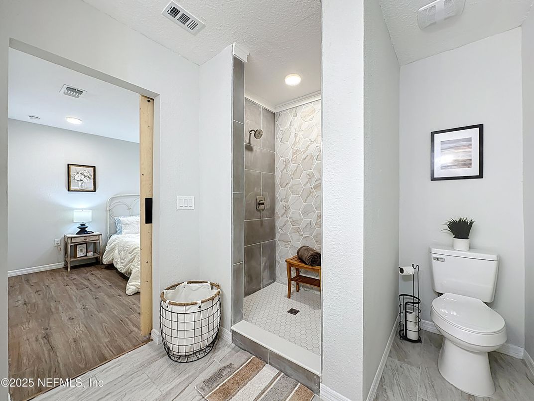 Bathroom, Bedroom, Glass Shower, Interior, Recessed Lighting, Wood Texture Flooring