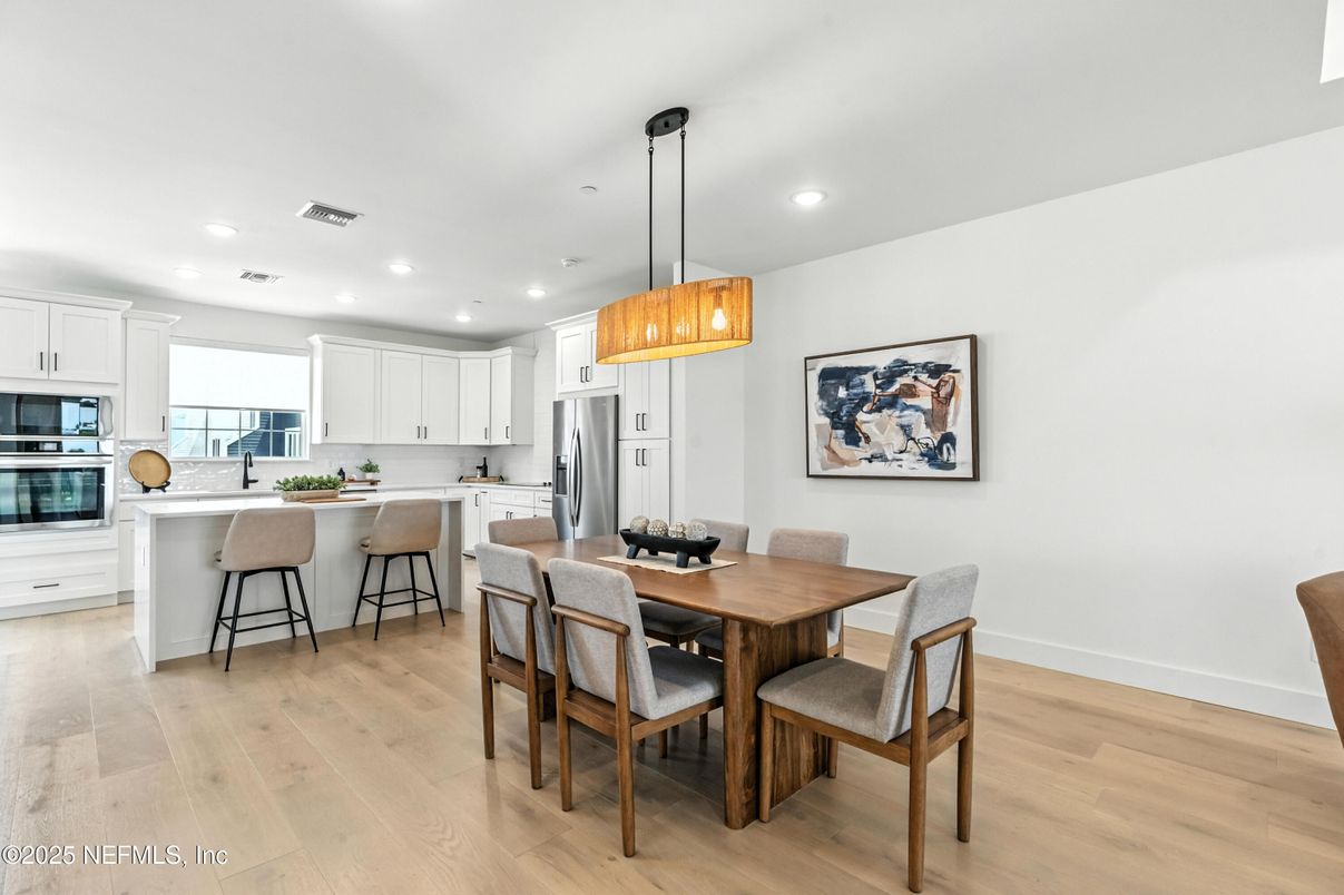 Dining room, Interior, Kitchen, Pendant Lights, Recessed Lighting, Stainless Steel Appliances, Wood Texture Flooring