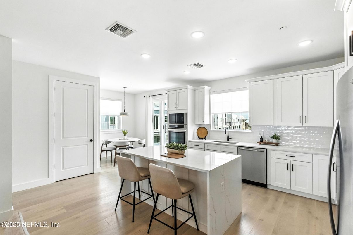 Dining room, Interior, Kitchen, Pendant Lights, Recessed Lighting, Stainless Steel Appliances, Wood Texture Flooring