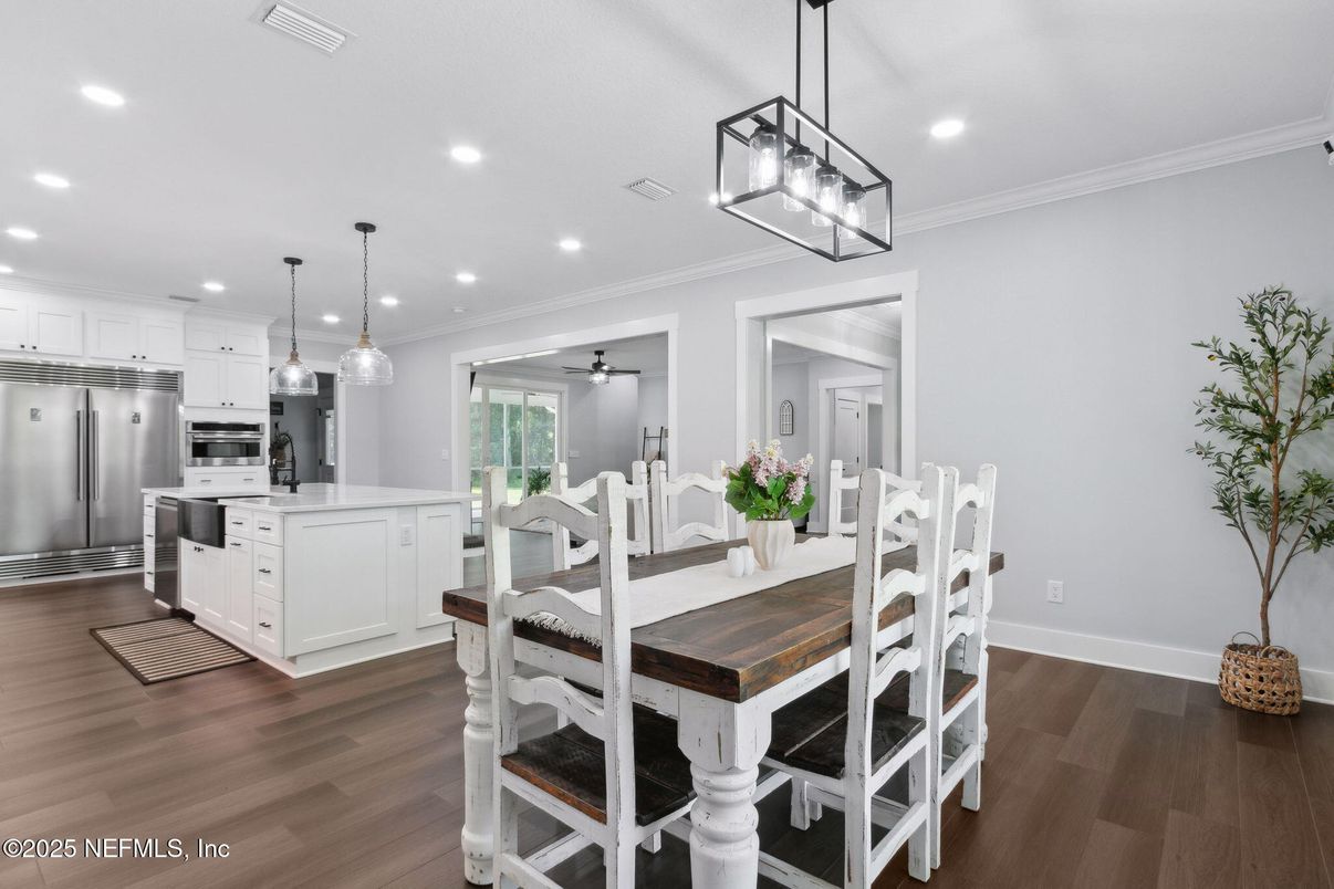 Dining room, Interior, Kitchen, Pendant Lights, Recessed Lighting, Stainless Steel Appliances, Wood Texture Flooring
