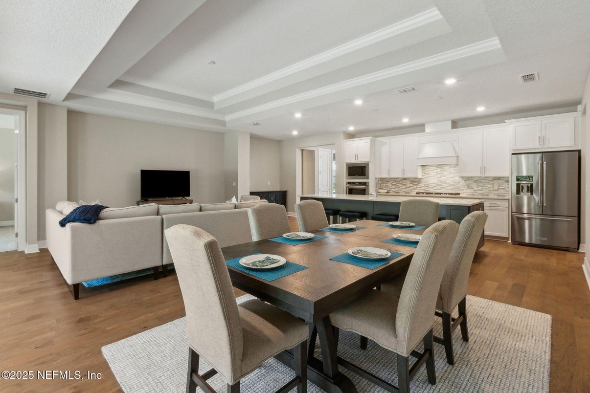 Dining room, Interior, Kitchen, Living room, Recessed Lighting, Stainless Steel Appliances, Wood Texture Flooring