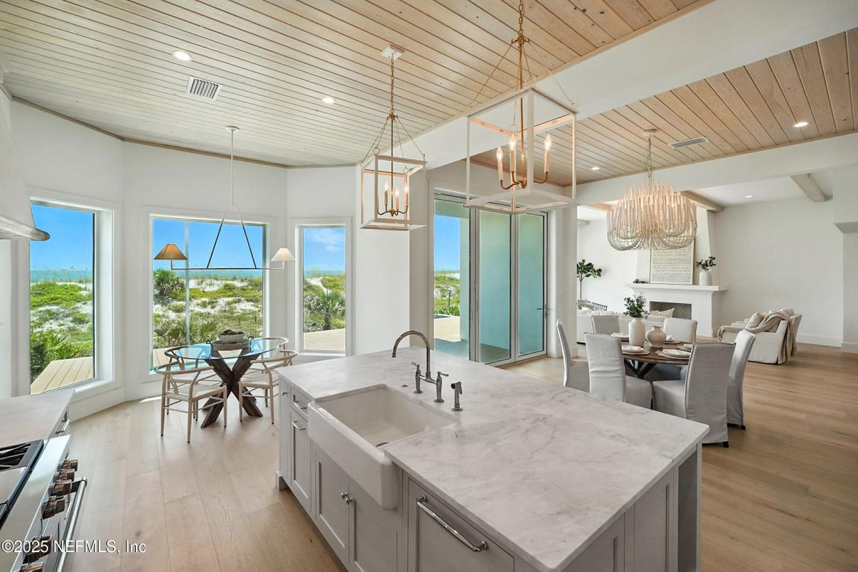 Chandelier, Dining room, Fireplace, Interior, Kitchen, Pendant Lights, Recessed Lighting, Wooden Ceilings, Wood Texture Flooring