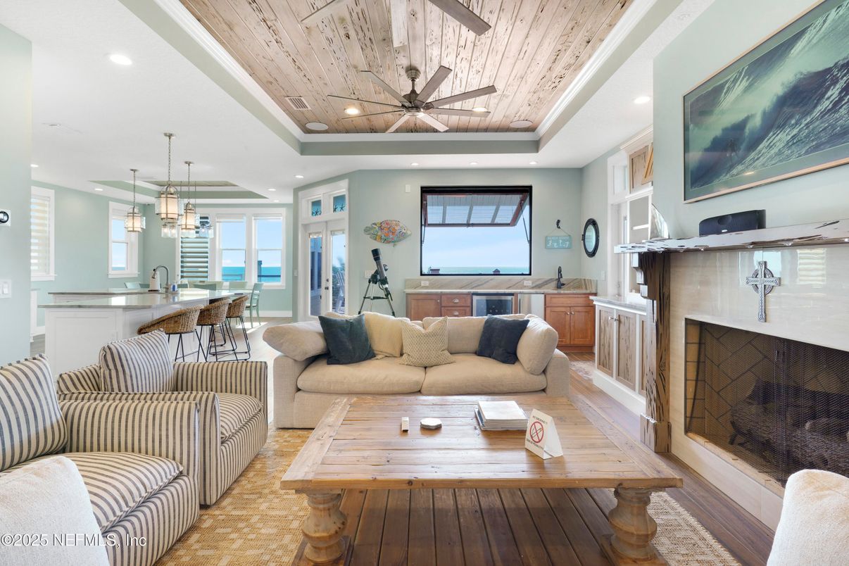 Dining room, Fireplace, Interior, Living room, Pendant Lights, Recessed Lighting, Wooden Ceilings, Wood Texture Flooring