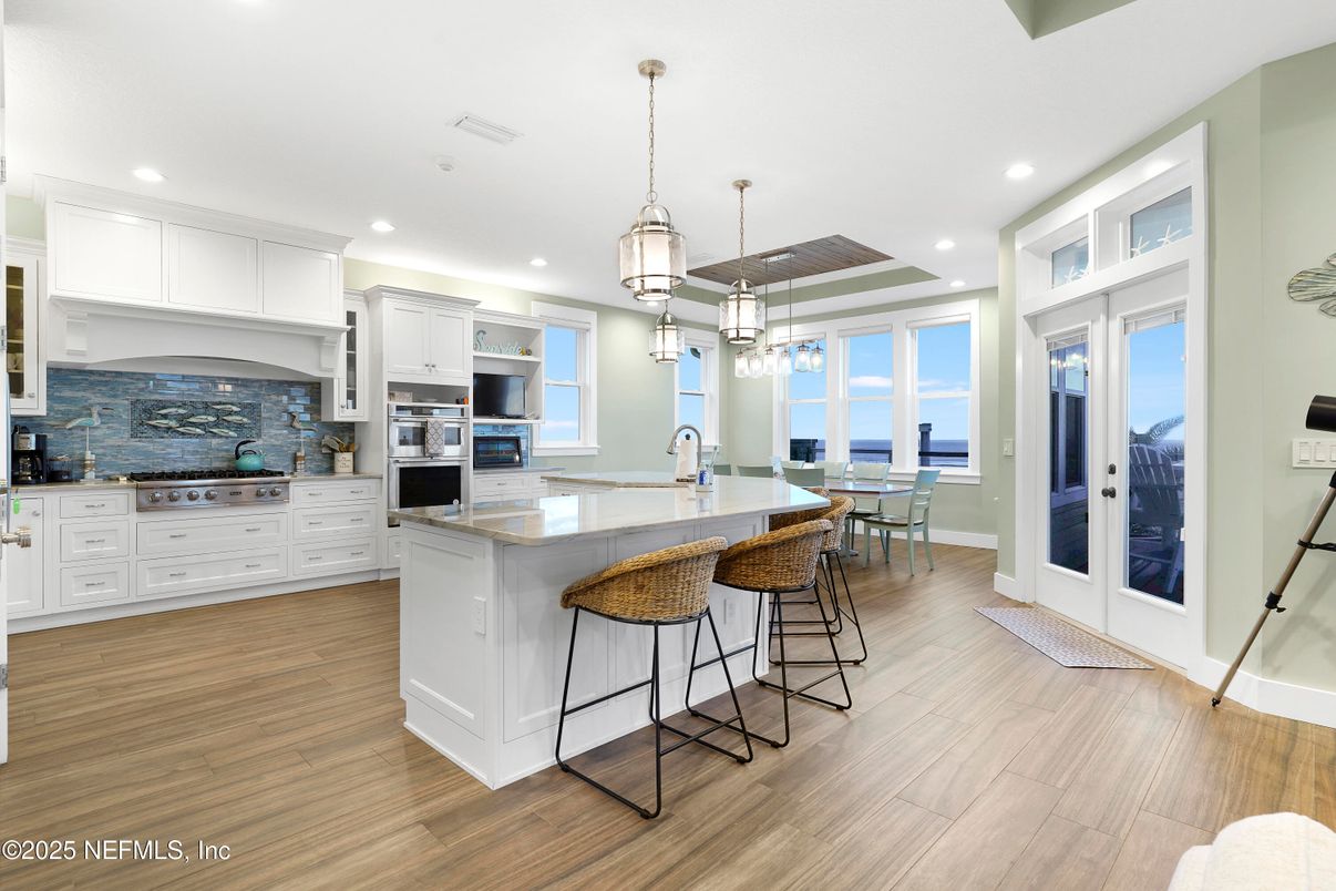 Dining room, Interior, Kitchen, Pendant Lights, Recessed Lighting, Stainless Steel Appliances, Water, Wood Texture Flooring