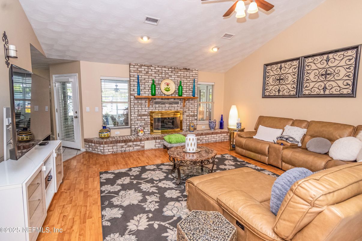 Fireplace, Interior, Living room, Recessed Lighting, Stone Walls, Wood Texture Flooring