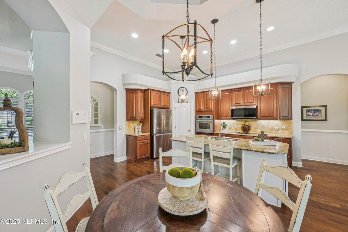 Dining room, Interior, Kitchen, Pendant Lights, Recessed Lighting, Stainless Steel Appliances, Wood Texture Flooring