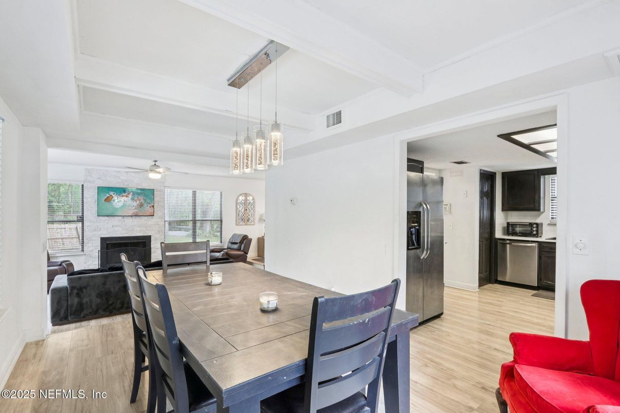 Dining room, Fireplace, Interior, Kitchen, Living room, Pendant Lights, Stainless Steel Appliances, Wood Texture Flooring