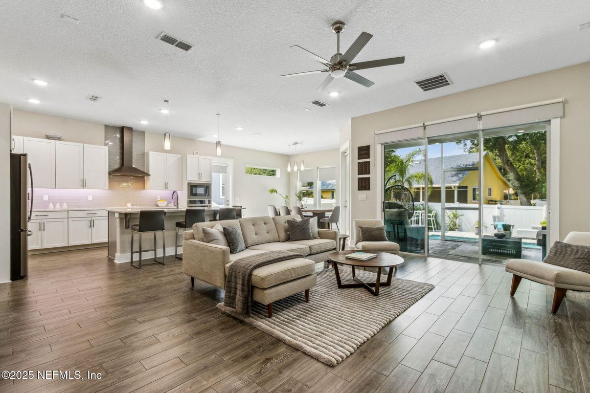 Dining room, Interior, Kitchen, Living room, Pendant Lights, Recessed Lighting, Stainless Steel Appliances, Wood Texture Flooring