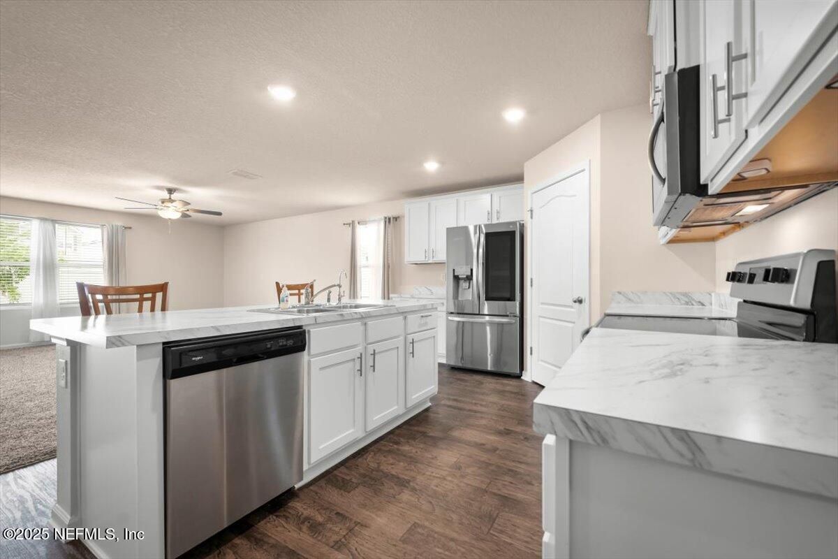 Dining room, Interior, Kitchen, Recessed Lighting, Stainless Steel Appliances, Wood Texture Flooring