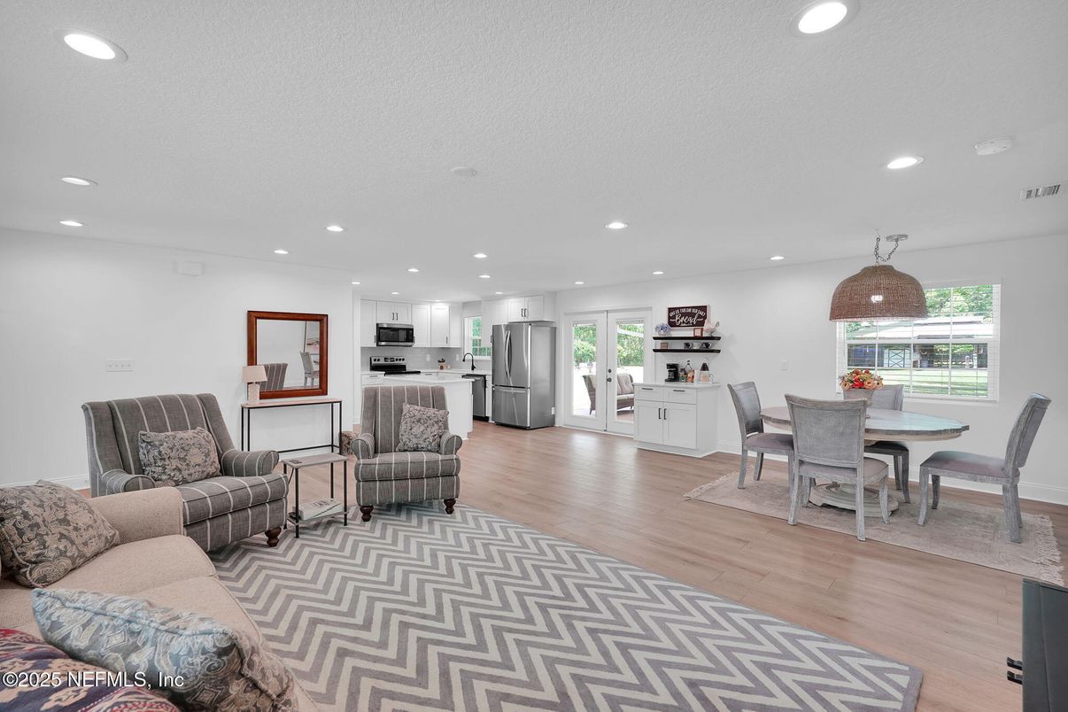Dining room, Interior, Kitchen, Living room, Recessed Lighting, Stainless Steel Appliances, Wood Texture Flooring