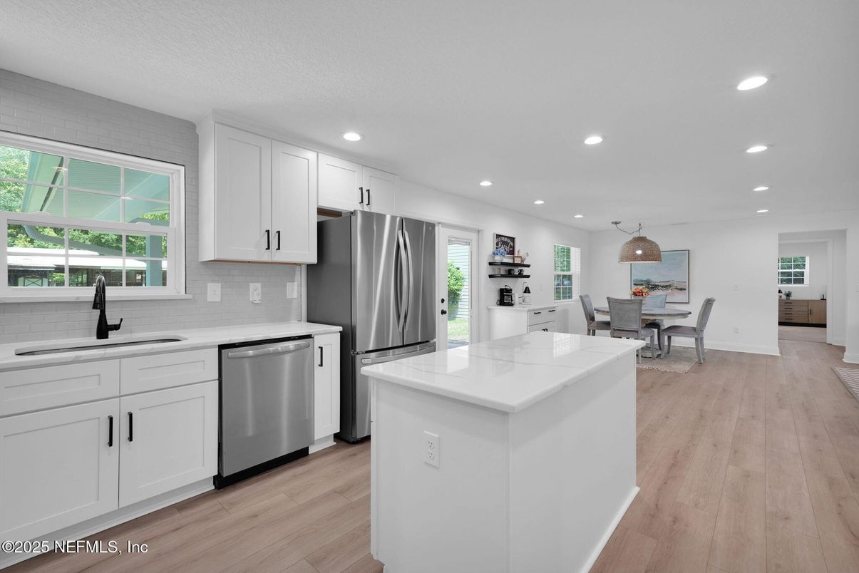Dining room, Interior, Kitchen, Pendant Lights, Recessed Lighting, Stainless Steel Appliances, Wood Texture Flooring