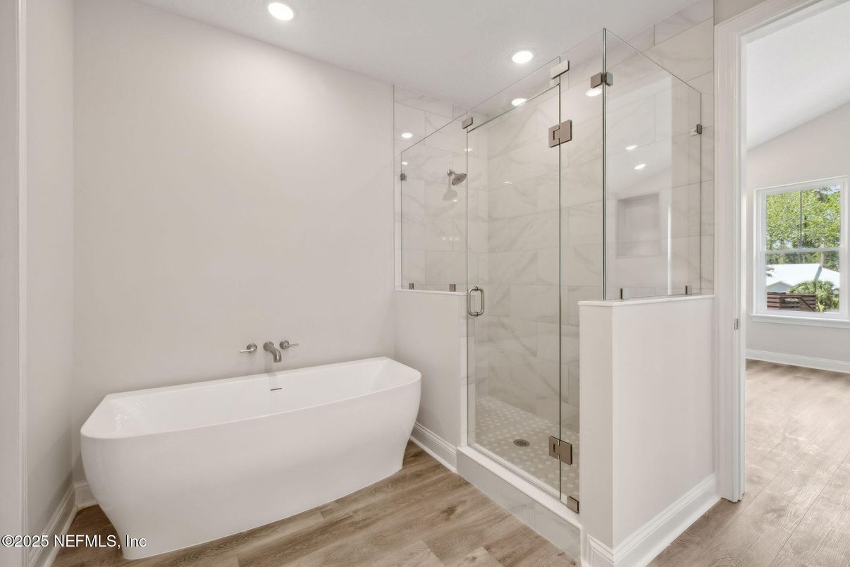 Bathroom, Free Standing Baths, Glass Shower, Interior, Marble Walls, Recessed Lighting, Wood Texture Flooring