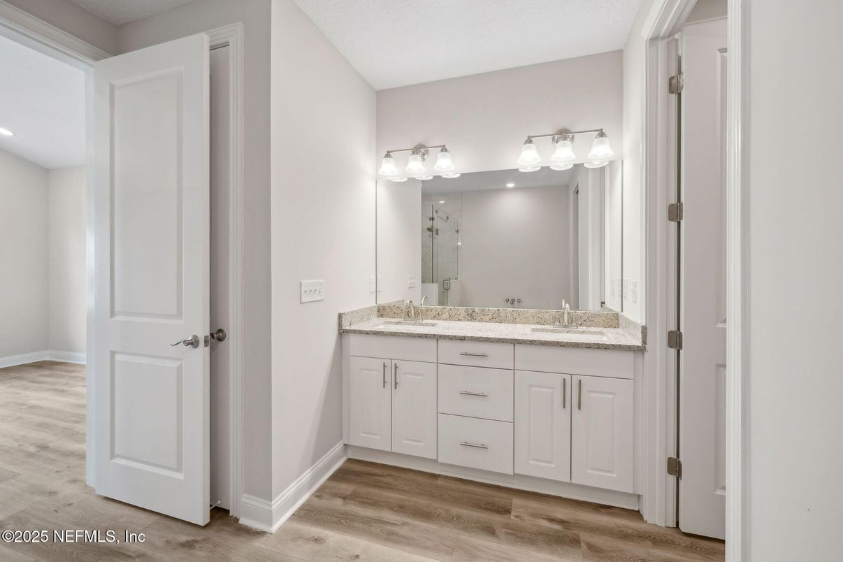 Bathroom, Dual Sink Vanities, Interior, Recessed Lighting, Wood Texture Flooring