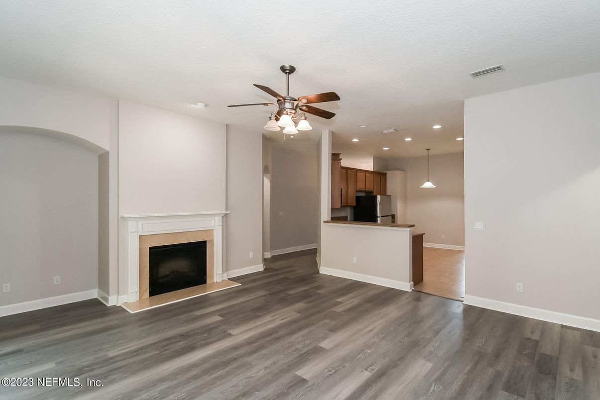Empty room, Fireplace, Interior, Kitchen, Pendant Lights, Recessed Lighting, Wood Texture Flooring