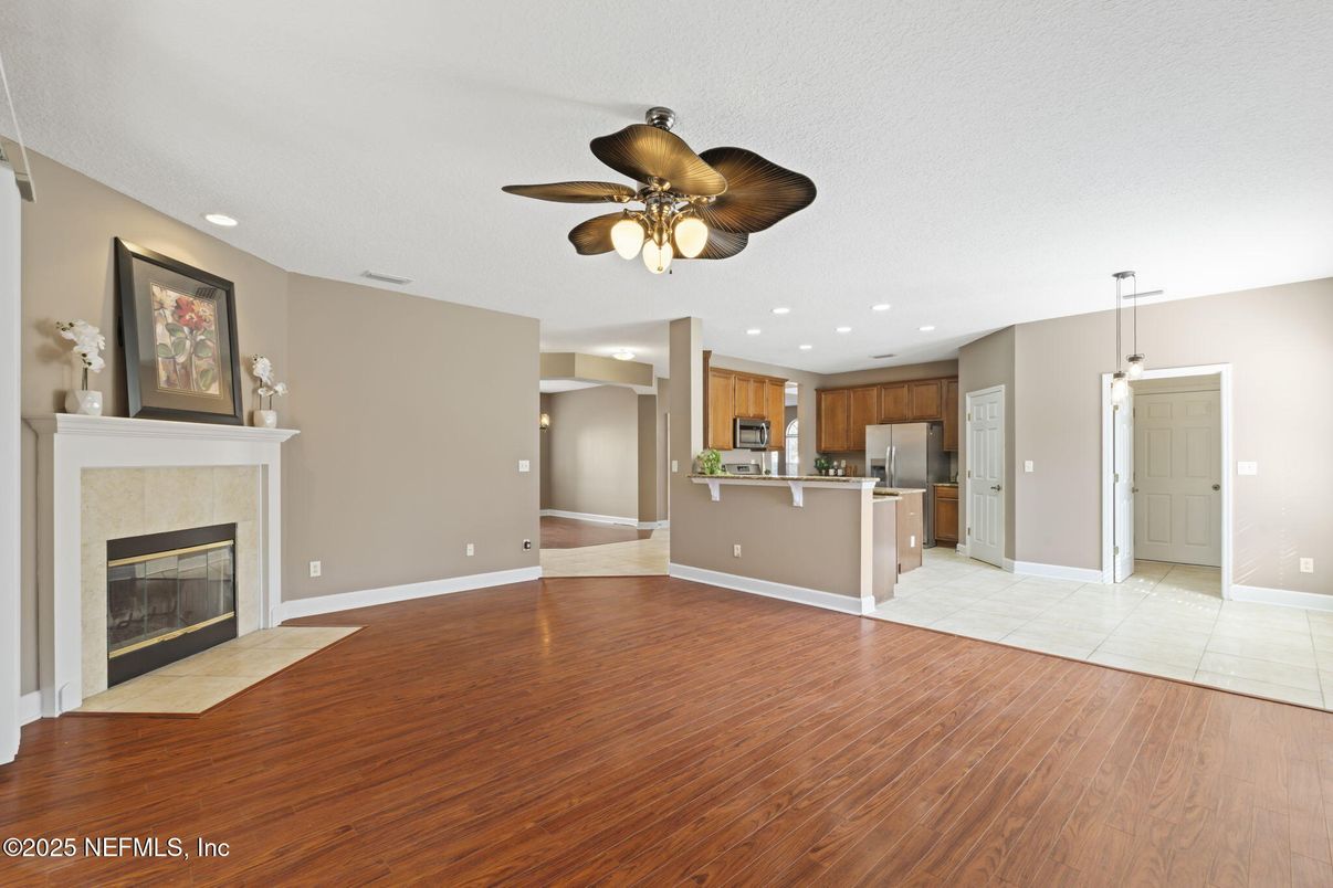 Empty room, Fireplace, Interior, Kitchen, Pendant Lights, Recessed Lighting, Wood Texture Flooring